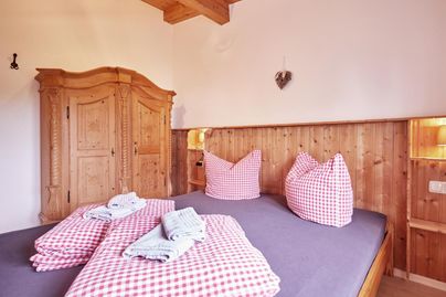 Ein Schlafzimmer im Ferienhaus Allgäutissimo in Immenstadt.
